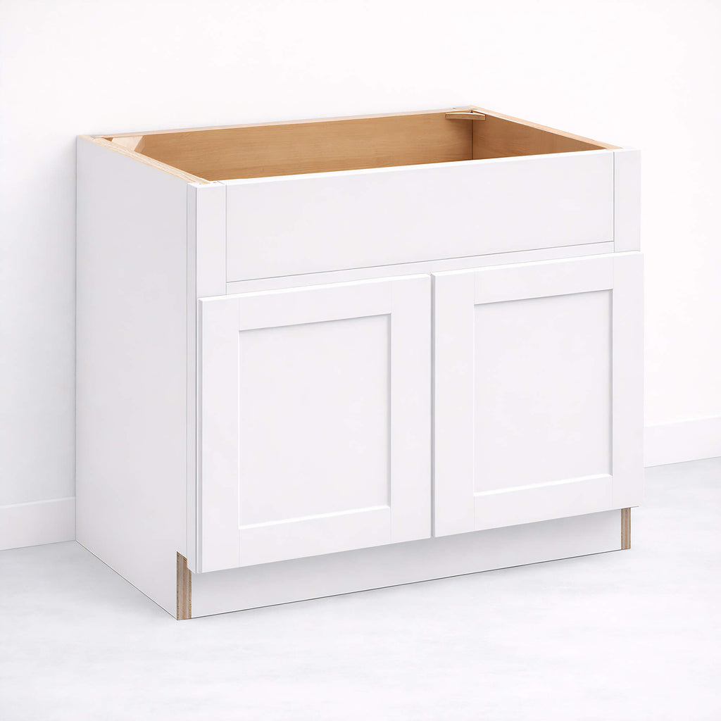 Farmhouse sink base cabinet with apron-front sink opening and double closed Shaker doors, 34 1/2 inch height and 24 inch depth.