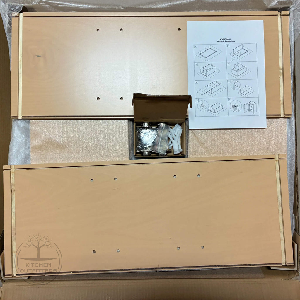 RTA wall cabinet components with assembly instructions and soft-close hinges included