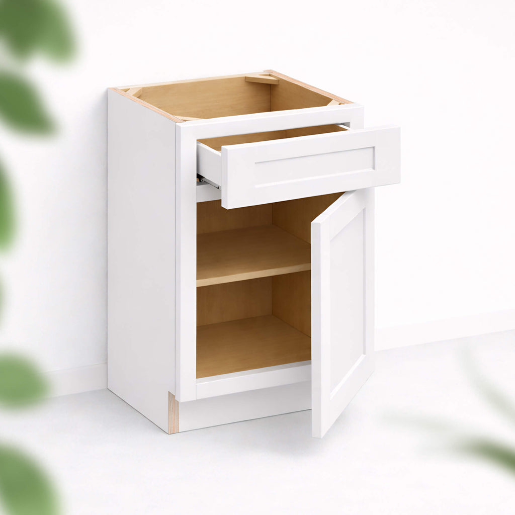 Base cabinet with one top drawer and one Shaker door partially open, 34 1/2 inch height and 24 inch depth, white finish.