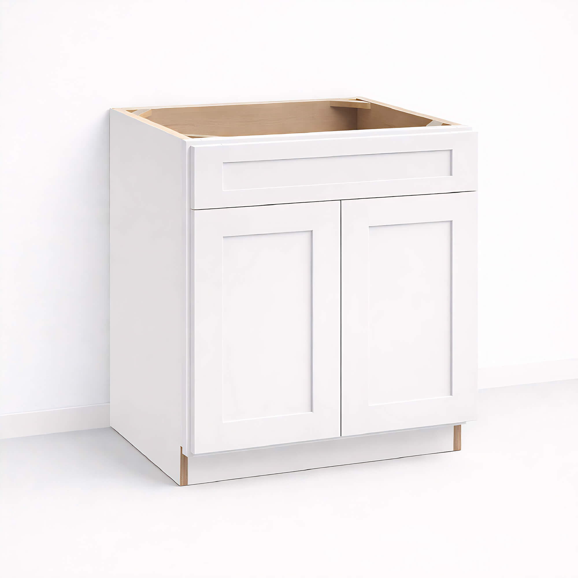 Base sink cabinet 34 1/2 inch height and 24 inch depth with closed Shaker style double doors and top drawer front, white painted finish, ready for sink installation.